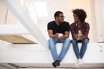 Image showing couple having break during moving to new house