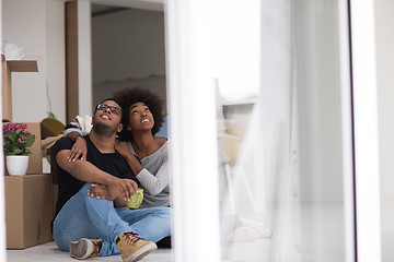 Image showing African American couple relaxing in new house