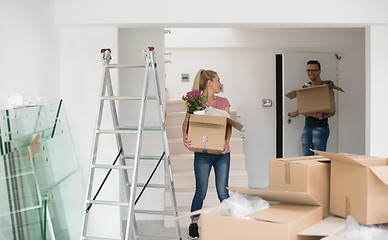 Image showing young couple moving into a new home