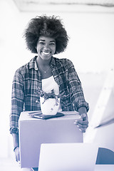 Image showing Black girl moving in the new apartment