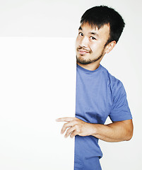 Image showing pretty cool asian man holding empty white plate smiling