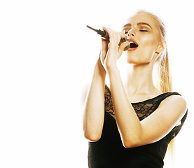 Image showing young pretty blond woman singing in microphone isolated close up