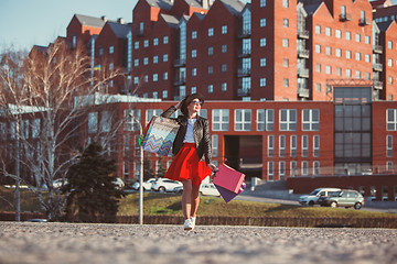 Image showing The girl walking with shopping on city streets