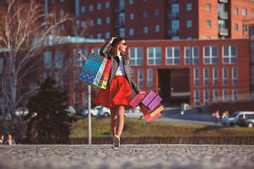 Image showing The girl walking with shopping on city streets