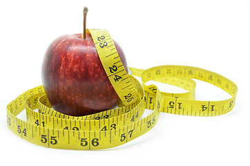 Image showing Red apple with measure tape