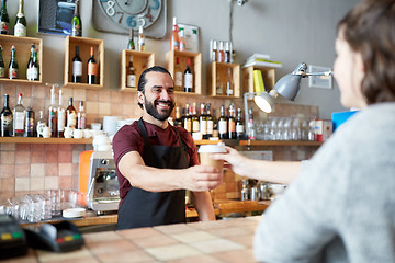 Image showing man or waiter serving customer in coffee shop