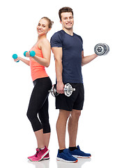 Image showing sportive man and woman with dumbbells