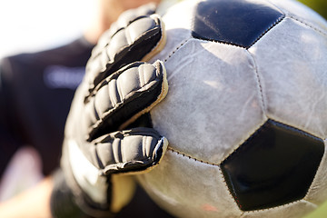 Image showing close up of goalkeeper with ball playing football