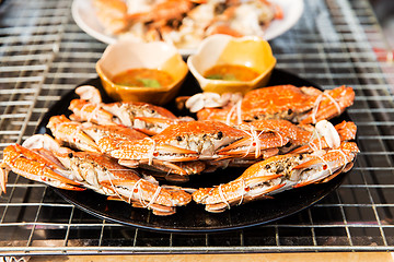 Image showing grilled crabs on plate at street market