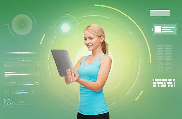 Image showing happy smiling sporty woman with tablet pc