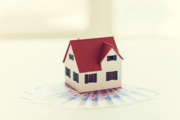 Image showing close up of home or house model and money