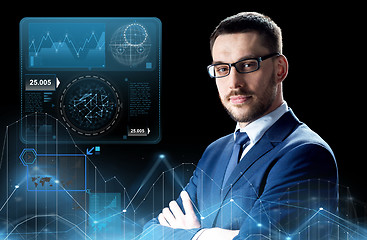 Image showing businessman in glasses with virtual charts