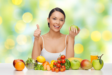 Image showing woman with fruits and vegetables showing thumbs up