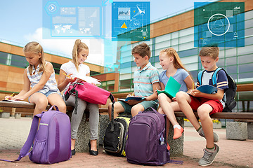 Image showing group of happy elementary school students outdoors