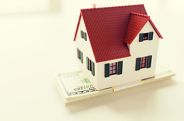 Image showing close up of home or house model and money