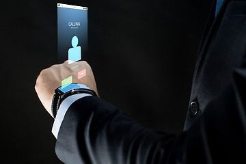 Image showing close up of businessman hand with smartwatch