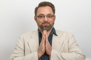 Image showing Young businessman meditates in lunchtime