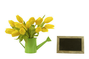 Image showing Beautiful tulips and blank blackboard