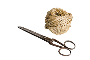 Image showing Old scissors and twine, it is isolated on white