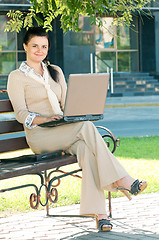 Image showing Business woman in summer park