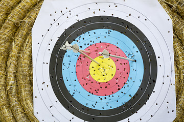 Image showing Archery Target With Arrows On a straw background