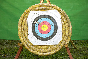 Image showing Archery Target With Arrows On a straw background