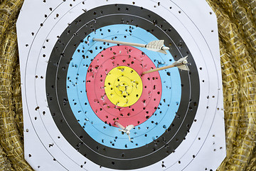 Image showing Archery Target With Arrows On a straw background