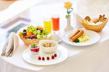 Image showing delicious breakfast for two at the luxury hotel.