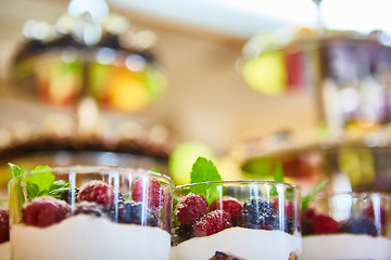 Image showing Blackberry and raspberry in the white yogurt.