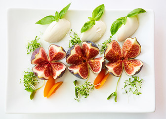 Image showing Filled figs with feta cheese. Top view.