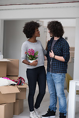 Image showing multiethnic couple moving into a new home