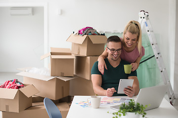 Image showing Young couple moving in a new home