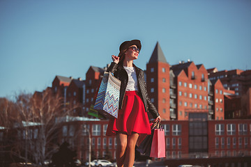 Image showing The girl walking with shopping on city streets