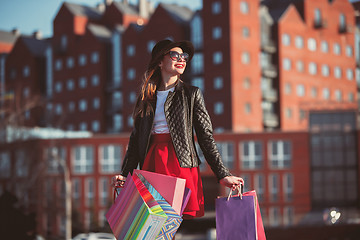 Image showing The girl walking with shopping on city streets