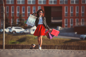 Image showing The girl walking with shopping on city streets