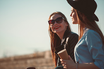 Image showing Two girls walking with shopping on city streets