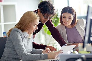 Image showing business team with tablet pc at office