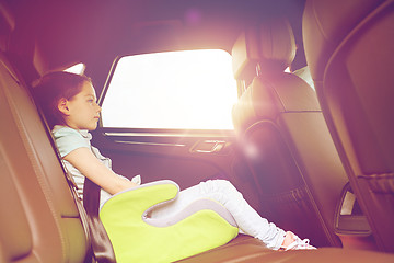 Image showing family with child in safety seat driving car