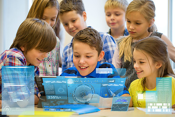 Image showing group of school kids with tablet pc in classroom