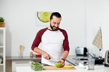 Image showing man with blender and fruit cooking at home kitchen