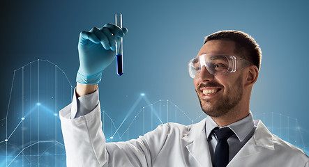 Image showing scientist in goggles with test tube and diagram