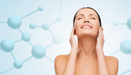 Image showing beautiful young woman face with molecules