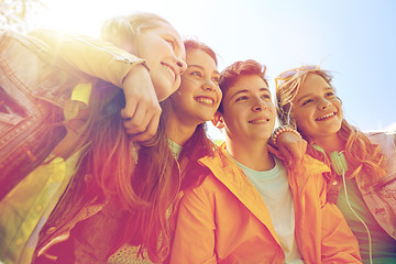 Image showing happy teenage students or friends outdoors
