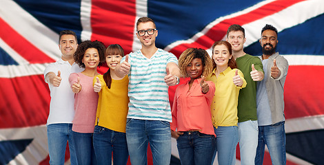 Image showing people showing thumbs up over english flag