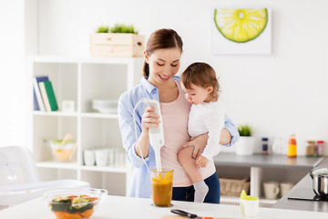 Image showing happy mother and baby cooking food at home kitchen