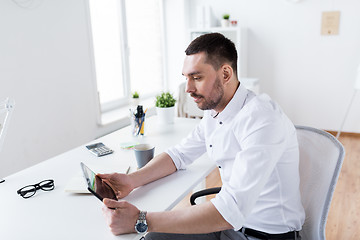 Image showing businessman with tablet pc at office