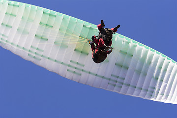 Image showing Paragliding in tandem, extreme sport, free gliding and blue sky 