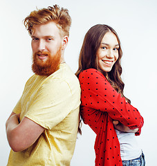 Image showing young pretty teenage couple, hipster guy with his girlfriend happy smiling and hugging isolated on white background, lifestyle people concept 