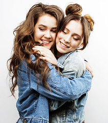 Image showing best friends teenage girls together having fun, posing emotional on white background, besties happy smiling, lifestyle people concept close up