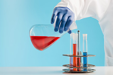 Image showing Experiments in a chemistry lab. conducting an experiment in the laboratory.